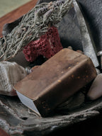 Patina brass matchbox holder handmade by 13 Knives resting in a ceramic dish with dried botanicals and objects in melbourne australia